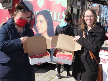 Lyndsay Jacklyn, left, Monique Garon were among those who lined up for the BeaversTails pastry truck that was on hand in Downtown Timmins for three days including during the Urban Park held on Saturday.

RON GRECH/The Daily Press