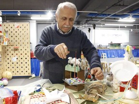 Antoine Garwah, president of Science Timmins, is seen here putting together some of the equipment that will be used during some of the upcoming activities planned when the Science Village re-opens next month. 

RICHA BHOSALE/The Daily Press