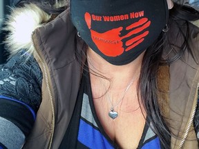 Valarie King, of Mississaugas of Credit First Nation, wears a mask to remember missing and murdered Indigenous women and girls. Handout