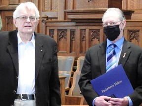 Simcoe Rotarian Ken Smith. left, presented a Paul Harris Fellowship to Simcoe musician Ian Madge on hehalf of the Simcoe Rotary Club on Sunday. Handout