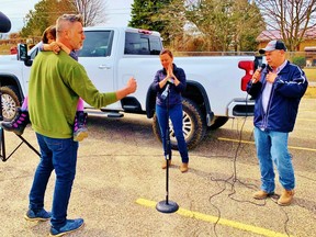 An unidentified farmer vents his frustration with local COVID-19 rules during a large rally at the Norfolk County Fairgrounds in Simcoe Tuesday. Hearing him out are Norfolk Mayor Kristal Chopp, chair of the Norfolk and Haldimand board of health, and Frogmore asparagus grower Frank Schonberger, an organizer of the March 23 protest. Monte Sonnenberg/Postmedia Network