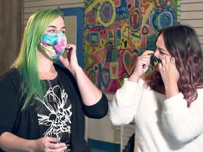 Leanne Zyba and Nikki Campbell Schram from Art With Heart Studio in Simcoe wear masks as they stand in front of Colourful Art from Episode 4-2 of Windecker Road Films production of Making Things Count: Pandemic Postcards. The show will be among titles available for free streaming during Watch Local Week April 18-24 via the Haldimand and Norfolk County Public Library websites. Submitted