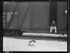 "Car on siding across tracks from pea packing plant. Twenty-five year old itinerant, originally from Oregon. "On the road eight years, all over the country, every state in the union, back and forth, pick up a job here and there, travelling all the time." Calipatria, Imperial Valley." Photo by Dorothea Lange. Photo taken in February 1939. Photo from the Farm Security Administration/Office of War Information Photograph Collection at the Library of Congress, Washington, DC.