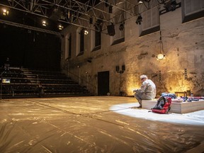 An artist of Cirk La Putyka troupe performs poetry on a stage in an empty theatre at the beginning of a three-week long performance called "An isolation of an artist" as the government imposed further restrictions to slow the spread of the coronavirus disease for the next three weeks on March 1 in Prague, Czech Republic.