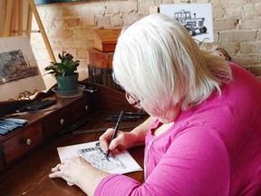 Jenny Phillips of Dutton works on a sketch in her studio. The local artist has been working on a book of sketches of Elgin County's barns. It's possible the book will be published this year. Dave Phillips photo
