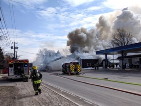 Meaford fire crews battled a blaze on Sykes Street in Meaford Wednesday afternoon. A corrugated metal warehouse next to a gas station caught fire west of the downtown core slightly before 1 p.m. Police closed Sykes Street (Highway 26) between Grandview Drive and Cook Street. Greg Cowan/The Sun Times.