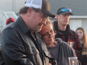 Jennifer "Jenny" Winkler's family joined friends and community members at a candlelight vigil for Winkler, the teen who was killed in an attack at Christ the King School last week.