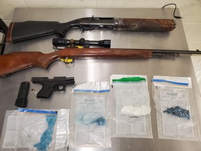 Ontario Provincial Police seized three firearms and approximately $34,600 of fentanyl and cocaine from a residence in Sturgeon Falls, Tuesday. Ontario Provincial Police Photo
