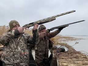 Canada in the Rough host and co-producer Keith Beasley, left, and guide Robert Stanley shoot at waterfowl at Mitchell's Bay, Ont., in December 2020. (Photo courtesy of OutdoorSpot Media Group)