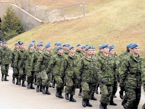Military personnel march out of the underground complex - The Hole - for the final time in 2006. The military is now looking at the final decommissioning of the centre.
Nugget File Photo