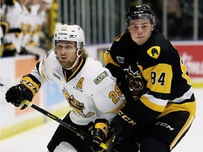 Sarnia Sting defenceman Kelton Hatcher, left, plays against the Hamilton Bulldogs at Progressive Auto Sales Arena in Sarnia, Ont., on Sept. 20, 2019. (Mark Malone/Chatham Daily News/Postmedia Network)