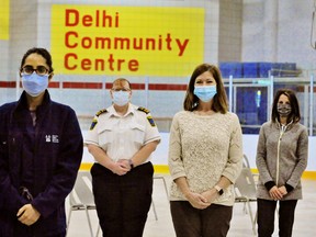 Sarah Page, second from left, Norfolk’s chief of paramedic services and co-ordinator of Norfolk and Haldimand’s COVID-19 vaccine rollout, gave members of the Family Health Team at the Delhi Community Health Centre a tour of the mass-vaccination facility at the Delhi arena on Wednesday. They include, from left, Dr. Ridhima Bijlani, family health team executive director Robin Mackie, and registered practical nurse Roxanne Pierssens-Silva. The vaccination centre in Delhi opens Friday. – Monte Sonnenberg