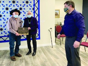 Ed and Ellen Plunkie were recognized with the Alberta Century Farm and Ranch Award on April 1. Pictured (l-r) Ed Plunkie, Ellen Plunkie and Maskwacis-Wetaskiwin MLA Rick Smith (Supplied by MLA Smith's office)