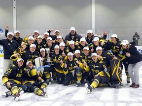 Paul Mara (back row, centre) and the Boston Pride celebrate after defeating the Minnesota Whitecaps 4-3 in the NWHL Isobel Cup Championship at Warrior Ice Arena in Boston, Massachusetts on March 27, 2021.