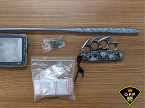 Quinte West OPP released this image of drugs, weapons and related paraphernalia seized Friday in Trenton.