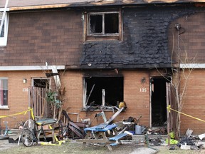 A man jumped from the second floor of a rowhouse that caught on fire in the Ryan Heights area early Sunday. A woman was found deceased on scene and a second resident reportedly died in hospital.