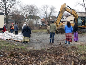 Participants in a ceremony marking the official start of construction of Suswin Village on Cassells Street watch as work begins, Tuesday morning. The 30-unit transitional housing project spearheaded by the North Bay Indigenous Friendship Centre is expected to be completed by the spring of 2022, with the first residents expected to move in by the summer of 2022.
PJ Wilson/The Nugget