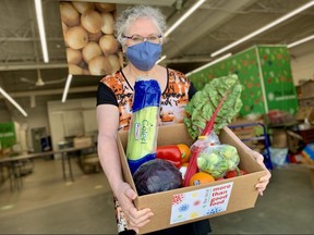 Debra Swan, executive director of the Local Community Food Centre, holds some of the produce the organization continues to make available during its twice-weekly Community Access Market, which is moving to a curbside pickup and delivery model.
Cory Smith/Stratford Beacon Herald
