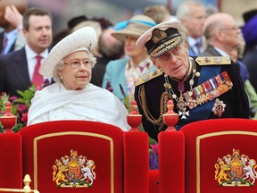 Britain's Queen Elizabeth II, Prince Philip watch the proceedings from the royal barge during the Diamond Jubilee Pageant on the River Thames in London Sunday June 3, 2012. More than 1,000 boats will sail down the River Thames on Sunday in a flotilla tribute to Queen Elizabeth II's 60 years on the throne that organizers are calling the biggest pageant on the river for 350 years. (AP Photo/John Stillwell, Pool)
