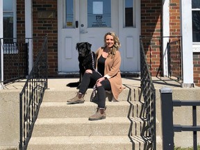 Sasha Ross poses with Trixie in front of Ryan's House in Sarnia. The Thedford woman is raising money with a run in September to help keep the recently opened addictions recovery facility operating. (Submitted)