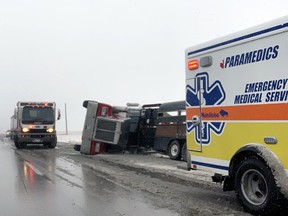 A semi trailer tipped over on the #1 Highway during Monday's snow storm. (Aaron Wilgosh/Postmedia)