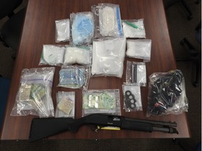 Drugs worth more than $50,000, along with a firearm and ammunition, were seized Tuesday as police carried out a search of a Sudbury residence. Three individuals face charges.
