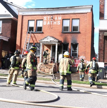 Firefighters respond to a fire at 340 Albert St. W., on Friday, April 16, 2021 in Sault Ste. Marie, Ont. (BRIAN KELLY/THE SAULT STAR/POSTMEDIA NETWORK)