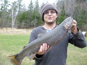 Proud Northerner Jean-M Kufske shows off his first-of-the-year rainbow trout, taken here in the North from a feeder stream leading into the North Channel. He was using a simple hook and worm rig.