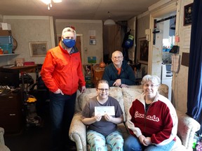 The Woodstock Rotary club, represented by Dave Harris, left made a $10,000 donation to the Ypma family recently. The family is raising money to purchase a wheelchair accessible van and bathtub for their home after their daughter Valery (centre) was diagnosed with cancer and lot the function of her left leg.  (Woodstock Rotary club)