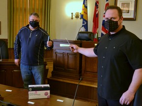 Stratford Mayor Dan Mathieson and City Centre BIA chair Rob Russell show off the rapid screening COVID-19 tests that will soon be available, free, to local businesses through the city’s new StaySafe pilot program. Galen Simmons/The Beacon Herald/Postmedia Network