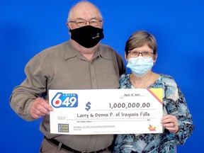 It might be hard to tell because of the masks, but Iroquois Falls residents Larry and Donna Porter were all smiles after winning the guaranteed $1 million prize in the March 17 LOTTO 6/49 draw. SUBMITTED PHOTO