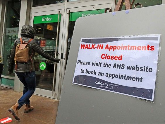 calgarians head into the covid-19 vaccination site at the telus convention centre on sunday, april 25, 2021. photo by gavin young/postmedia