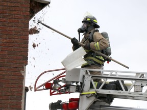 A firefighter responds to a call at 292 Wellington St. W., on Sunday, April 25, 2021 in Sault Ste. Marie, Ont. (BRIAN KELLY/THE SAULT STAR/POSTMEDIA NETWORK)