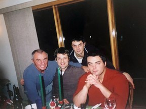Legendary swim coach Jeno Tihanyi, left, with sons Miklos, Andrey and Sacha.