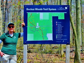 The Nature Conservancy of Canada and other groups that maintain trail networks in Norfolk would like anyone with information regarding an individual who has a long history of vandalizing local trails to share it with the Ontario Provincial Police or Crime Stoppers of Norfolk and Haldimand. Above, Liv Monck-Whipp, a conservation biologist with the Nature Conservacy of Canada, which owns the Backus Woods. – Monte Sonnenberg