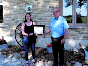 Gracie Goodhill, the 2020 recipient of the Mary Jo Arnold Conservation Scholarship, receives her award from SCRCA chair Joe Faas. The SCRCA is currently accepting applicants for its 2021 scholarships. Handout/Sarnia This Week