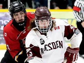 Dresden Kings' Darien Davis (25) battles Blenheim Blades' Jaxon Boucher (24) in front of the Blades' net at the Dresden arena in this file photograph from December 2019. File photo/Courier Press