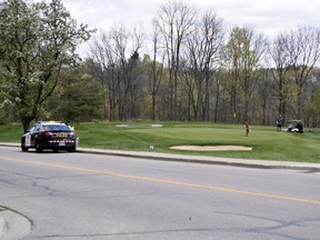 Oxford OPP officers were at The Bridges in Tillsonburg golf course Friday, taking notes and snapping photos of golfers. The golf course was charged Thursday night under the Reopening Ontario Act for violating the province's lockdown orders. (KATHLEEN SAYLORS/Postmedia Network)