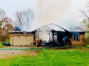 One person was injured in a fire at a home on Angling Road north of Waterford Thursday that caused an estimated $450,000 in property damage. – Norfolk County photo