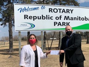 Rotary Club of Portage President Nathan Peto presenting the cheque to PRRA General Manager Angie Shindle. (supplied photo)