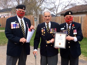 Morel Chaput (centre), a member of the Pembroke Legion for more than six decades, was recently presented with a life membership by Branch 72 first vice-president Romeo Levasseur and president Stan Halliday (right).