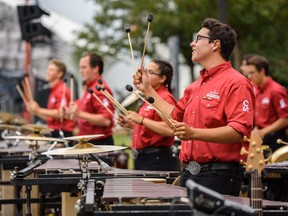 Jeremy Guenther, a member of Calgary Stampede Show bandÕs Front Ensemble plays percussion outside Scotiabank Saddledome on Friday, July 12, 2019. Azin Ghaffari/Postmedia Calgary