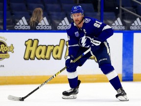 Steven Stamkos of the Tampa Bay Lightning looks to pass during a game against the Chicago Blackhawks on opening night of the 2020-21 NHL season  at Amalie Arena on January 13, 2021, in Tampa, Florida. (Photo by Mike Ehrmann/Getty Images)