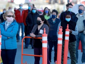 Larger than usual lineups that stretched to the back of the store at the Costco in Barrhaven Wednesday morning in anticipation of the coming provincial lockdown.