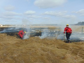 The Whitecourt Fire Department responding to, and extinguishing, a grass fire west of town on Wednesday.