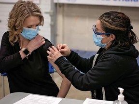 A health care worker gives Laila Goodridge, UCP MLA for Fort McMurray-Lac La Biche, a COVID-19 vaccine at the vaccination centre at MacDonald Island Park on Thursday, April 15, 2021. Photo supplied by Wood Buffalo Media Group