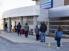 OTTAWA — A new COVID-19 testing centre opened Monday at the Howard Darwin Centennial Arena. People were lined up for the 8:30 a.m. opening. ERROL MCGIHON, Postmedia