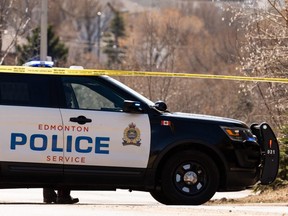 Edmonton Police Service officers blocked off Alex Taylor Road while conducting an investigation in Edmonton, on Sunday, April 25, 2021. Edmonton police have charged a man after a road rage assault that appears to have been racially motivated.