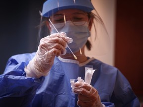 Shauna Mondin, a nursing student, gives COVID-19 rapid tests on March 1, 2021. Leah Hennel/AHS