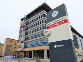 The Peter Lougheed Centre hospital was photographed on Wednesday, March 24, 2021. 
 Alberta needs to introduce stricter restrictions quickly to bring down COVID-19 hospitalizations, two Alberta doctors said as the province announced a reduction in surgeries to increase patient capacity.